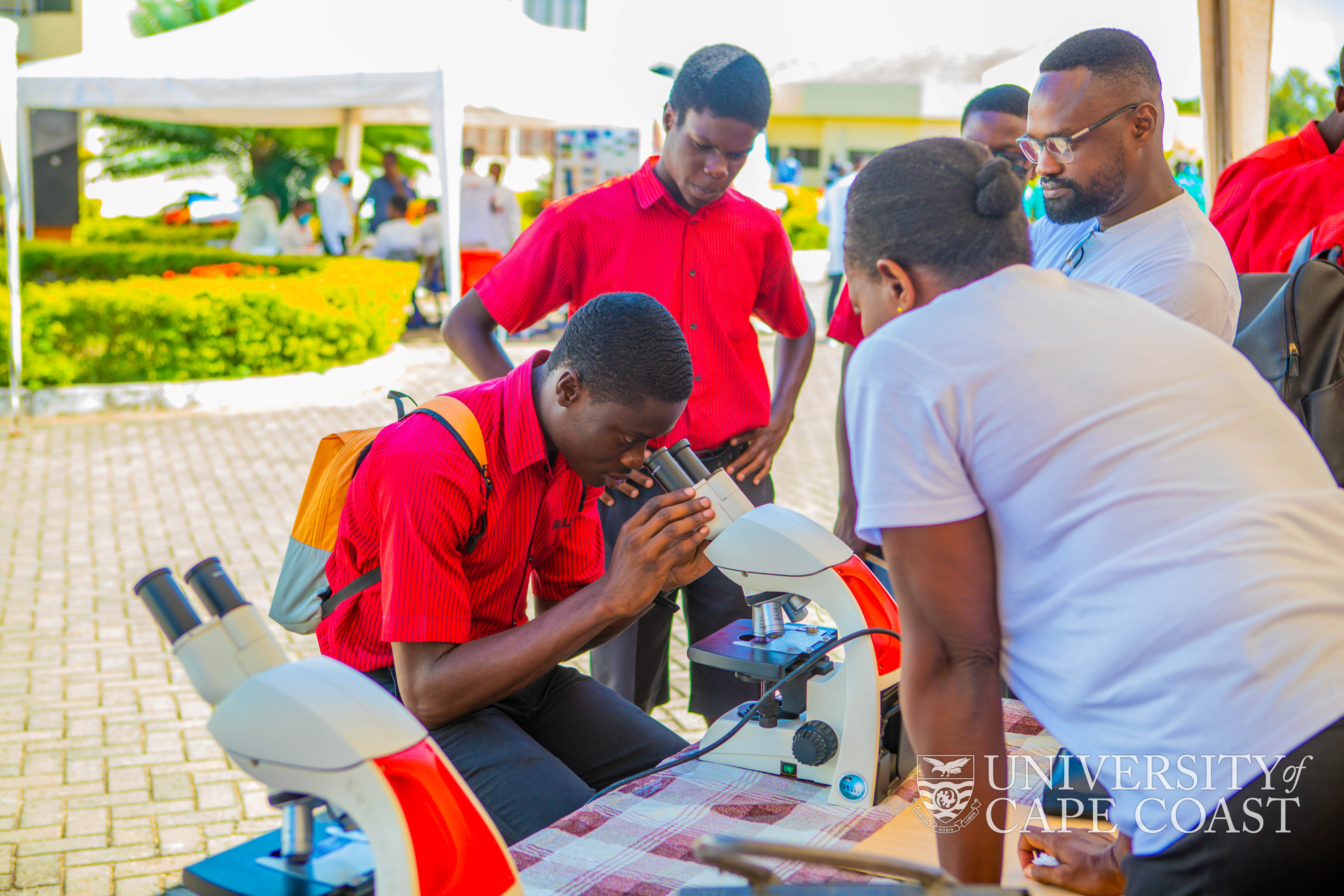 A student of Mfantsipim School having a practical session at one of the stands during the CoHAS Day Exhibition
