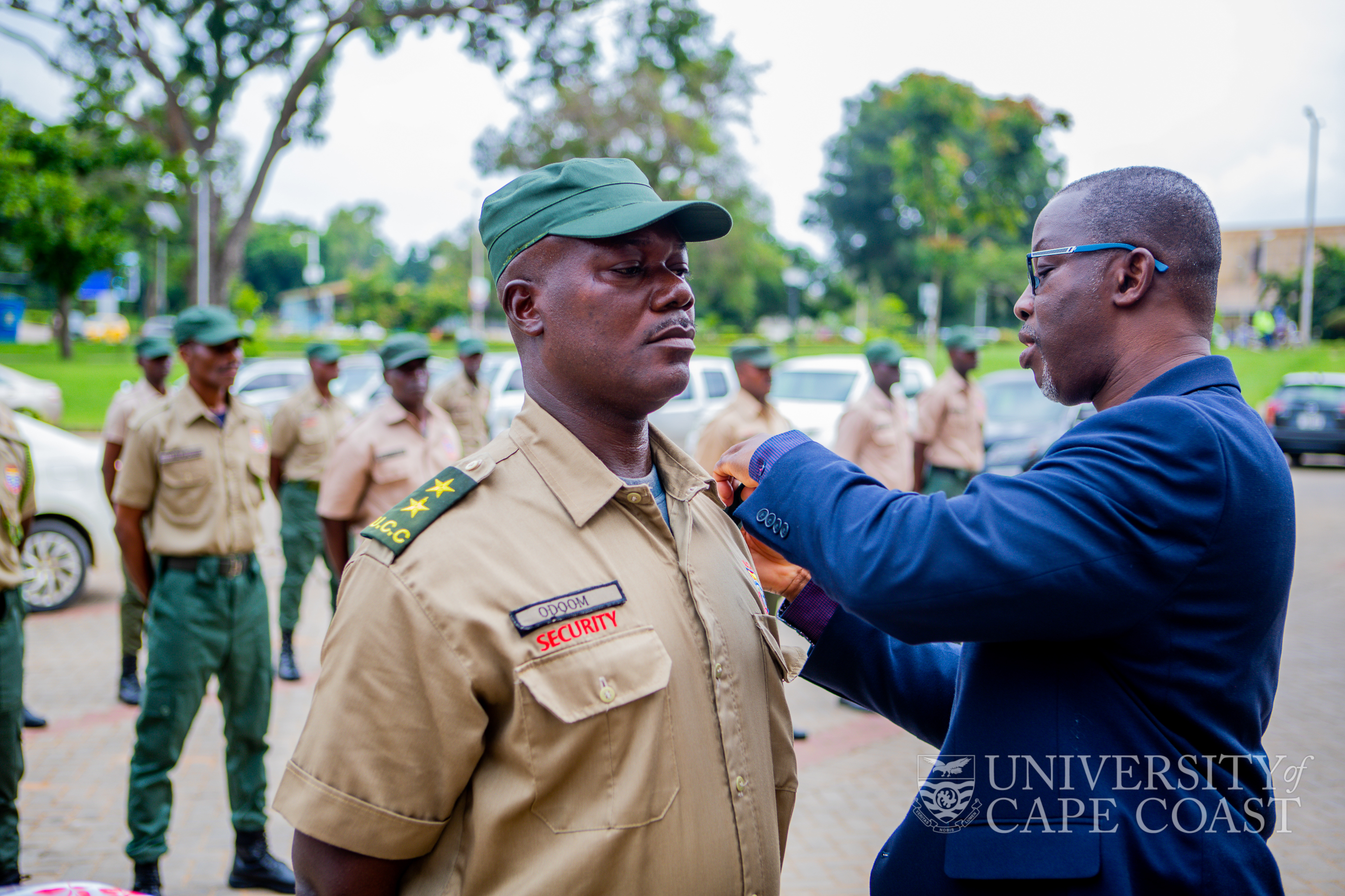 Prof. Eghan decorating a promoted security personnel with a new rank