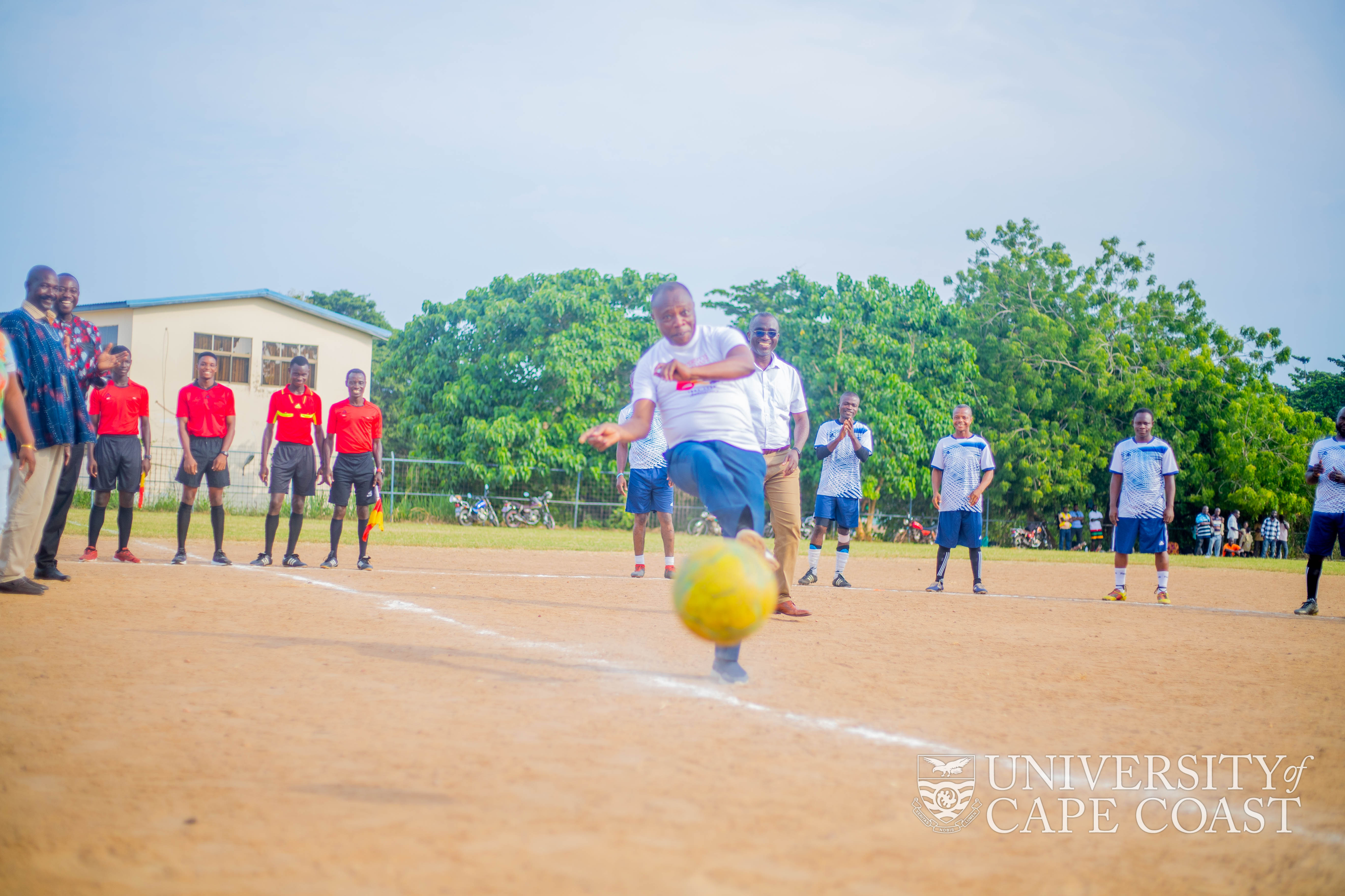  Prof. G. K. T. Oduro kicking a football to commence the final match of the 2022 Staff Games
