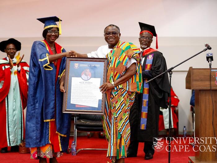 Mr. Felix Nyante receiving a citation from the Pro Vice-Chancellor Mr. Felix Nyante receiving a citation from the Pro Vice-Chancellor